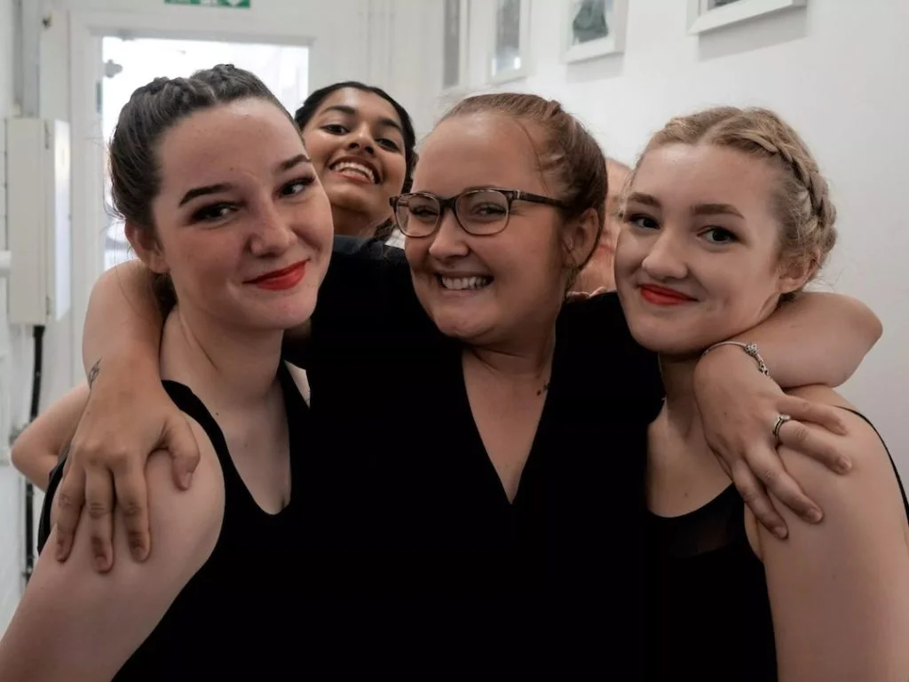 Hype Dance students celebrating after a dance performance