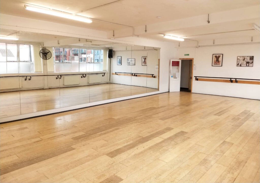dance-studio-1 A large, bright and airy wooden floored dance studio in Sheffield. It has a full wall of mirrors and ballet barres